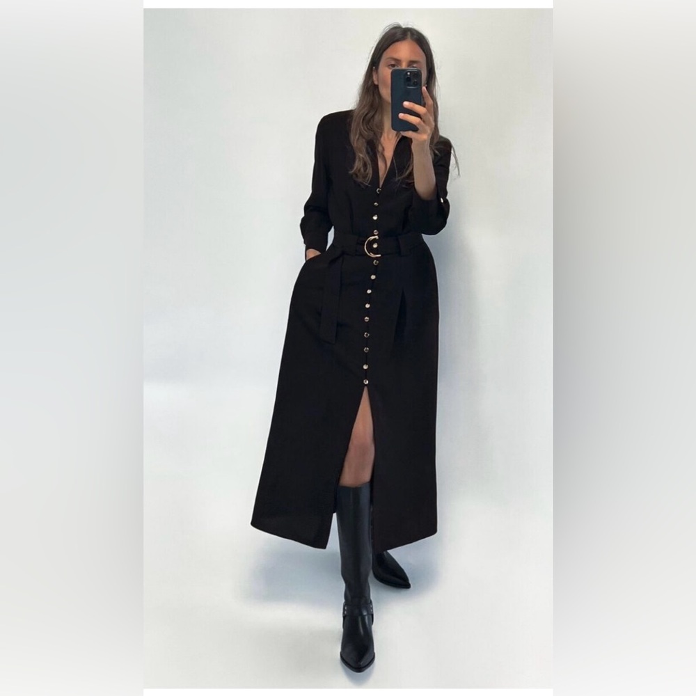 Sleeveless fitted dress with a high neck.